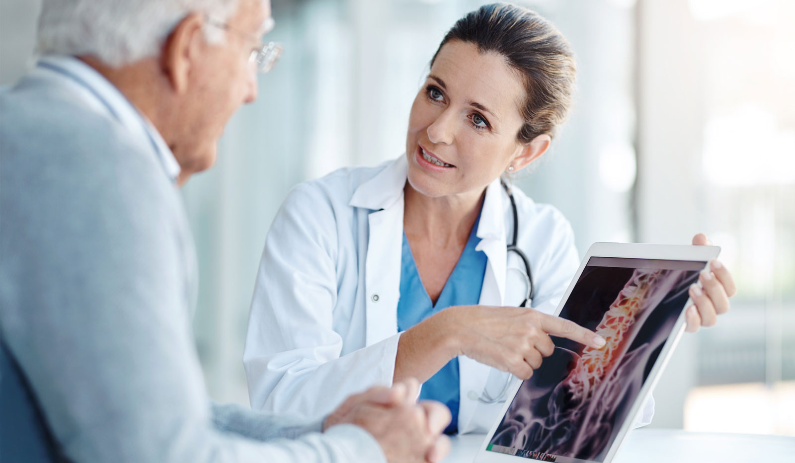 Doctor discussing spine scan with patient